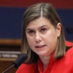 Senator Elissa Slotkin speaking at a podium