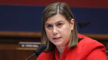 Senator Elissa Slotkin speaking at a podium