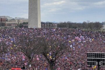 Virginia state capitol building with flags
