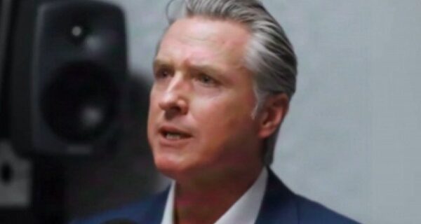 Silhouette of city skyline with dollar signs to suggest wealth leaving