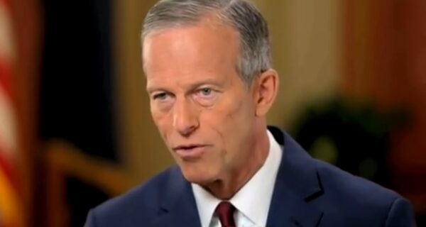 Capitol building at dusk with lights on