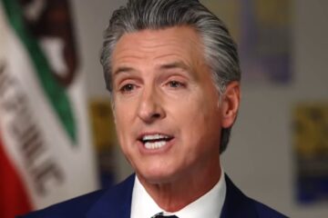 Gavin Newsom speaking at a press conference