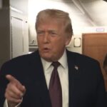Donald Trump speaking to reporters on Air Force One
