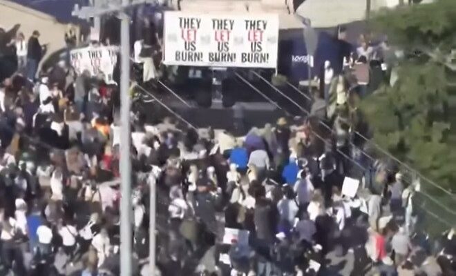 Crowd of Pacific Palisades residents protesting one year after wildfires