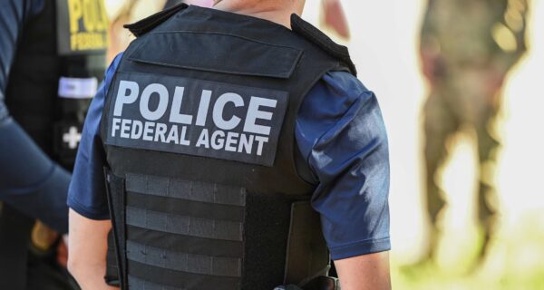 Crowd with American flags and fundraiser graphic representing online donations