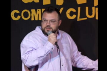 Comedian Ben Bankas performing on stage