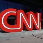 Television screens showing CNN logo with ratings down