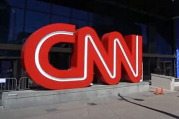 Television screens showing CNN logo with ratings down