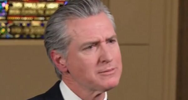 Gavin Newsom speaking in an interview, looking animated