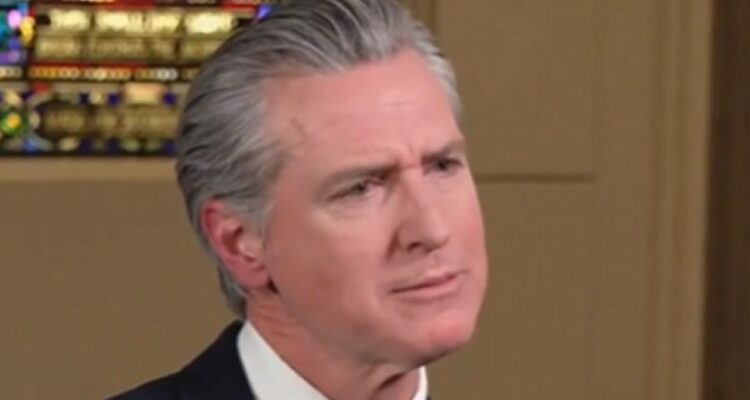 Gavin Newsom speaking in an interview, looking animated