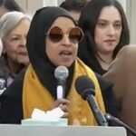 Rep. Ilhan Omar speaking at a podium