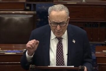 Senator Chuck Schumer speaking at a podium