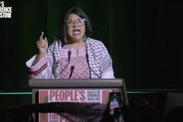 Rep. Rashida Tlaib speaking at a podium