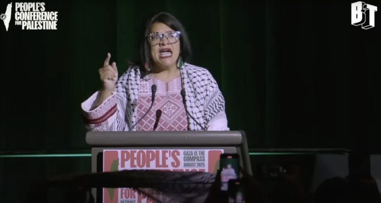 Rep. Rashida Tlaib speaking at a podium