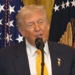 President Donald Trump speaking at White House; Dr. Ben Carson applauding