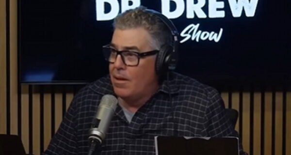 Adam Carolla speaking during a podcast appearance