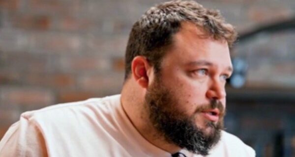 Ben Bankas performing stand-up on stage