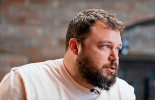 Ben Bankas performing stand-up on stage