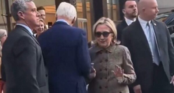 Bill and Hillary Clinton walking in New York City