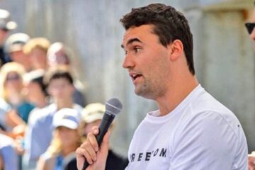 Memorial candles and flowers for Charlie Kirk