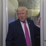 President Donald Trump speaking to reporters on Air Force One