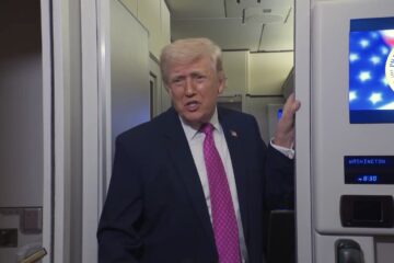 President Donald Trump speaking to reporters on Air Force One