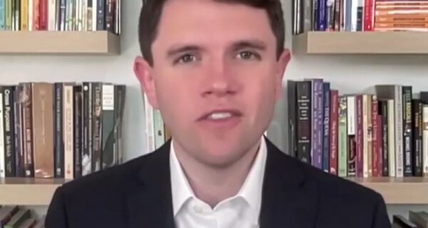 Classroom wall with student essays and political images