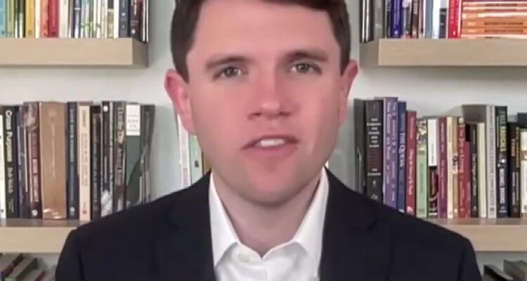 Classroom wall with student essays and political images