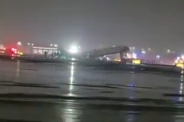 Airplane damaged on runway at LaGuardia after collision with firetruck