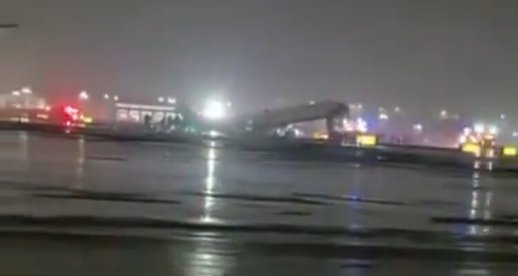 Airplane damaged on runway at LaGuardia after collision with firetruck