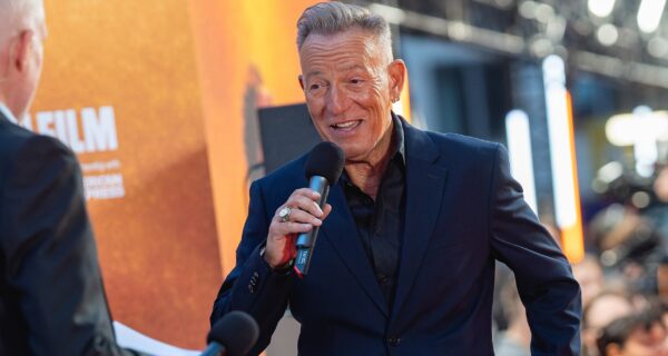 Crowd at concert with ticket price headline