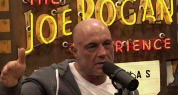 Joe Rogan speaking into a microphone on his podcast