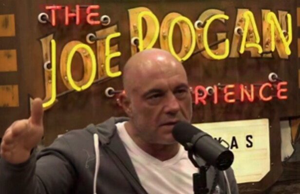 Joe Rogan speaking into a microphone on his podcast