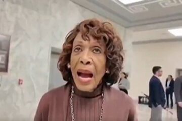 Rep. Maxine Waters speaking at a podium