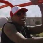 Nick Cannon speaking into a microphone