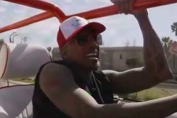 Nick Cannon speaking into a microphone