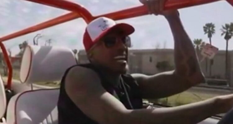 Nick Cannon speaking into a microphone