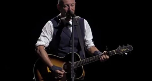 Bruce Springsteen performing on stage in Newark