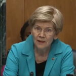 Kevin Warsh testifies during a Senate hearing as Elizabeth Warren questions him