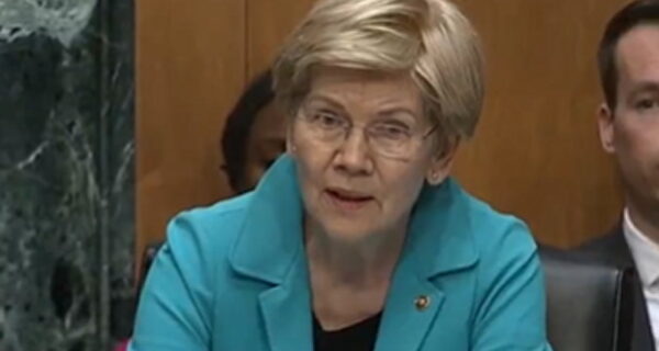 Kevin Warsh testifies during a Senate hearing as Elizabeth Warren questions him