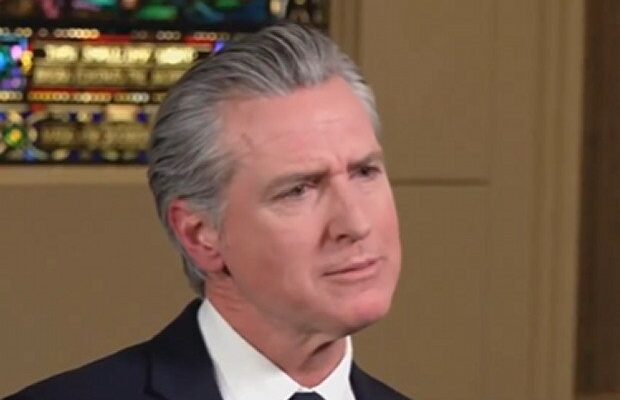 Gavin Newsom speaking at a podium