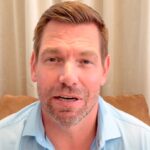 Eric Swalwell speaking at a podium