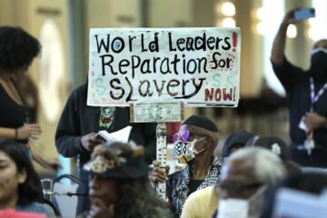 City Hall with Baltimore skyline, representing reparations fund controversy