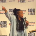 Rep. Summer Lee speaking at a campaign rally in Michigan
