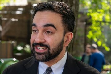 Zohran Mamdani speaking at a public event about city-run grocery stores