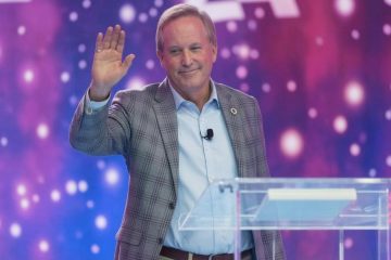 Ken Paxton speaking at a press conference in Texas