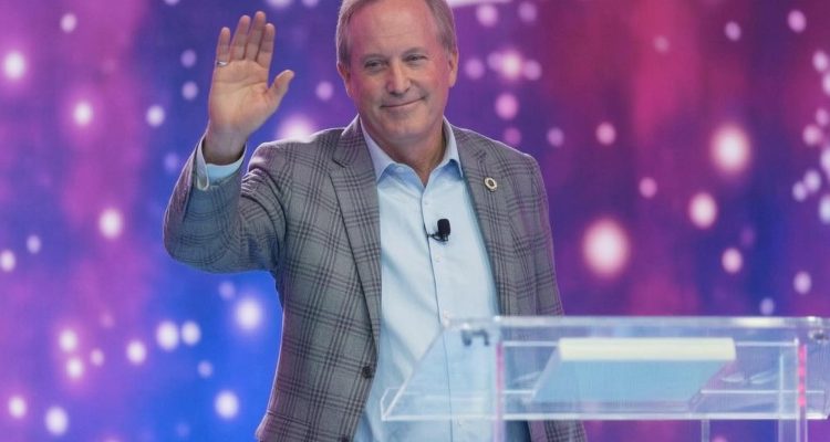 Ken Paxton speaking at a press conference in Texas