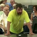 A Cape Cod resident speaking at a county meeting about immigration policy and taxpayer costs.