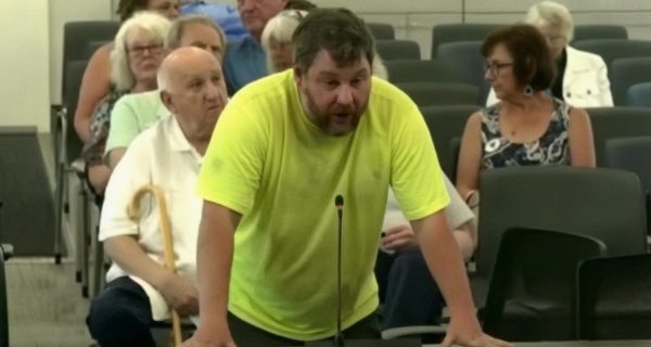 A Cape Cod resident speaking at a county meeting about immigration policy and taxpayer costs.