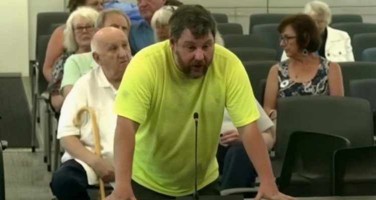 A Cape Cod resident speaking at a county meeting about immigration policy and taxpayer costs.